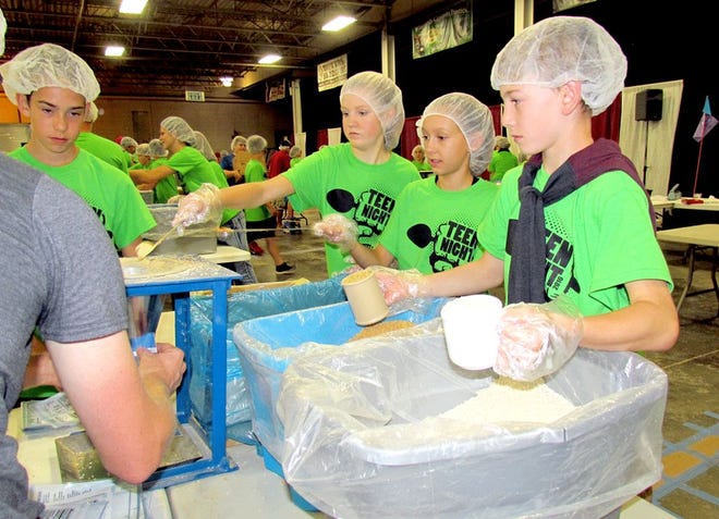 Rosalie Currier/Journal
Aiden Wisler, Rylie Miller, Mckenzie Pieronski and Micah Lemings, youth from Radiant Life Church in Sturgis, were among 300 who volunteered at Feed My Starving Children on Sept. 9.