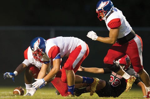 West Craven’s defense chases a loose ball during a high school football game against New Bern. West Craven plays host to D.H. Conley at 7 p.m. on Vanceboro.