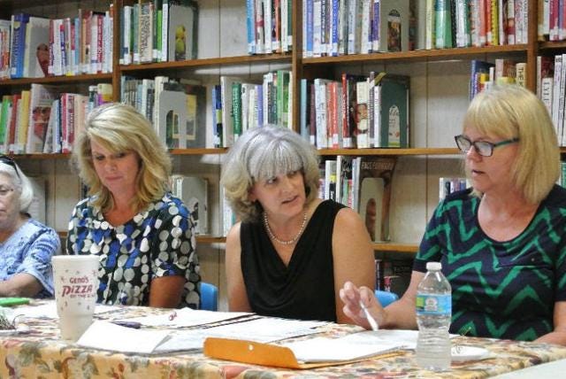 Crawford County Library Board Chairman Jami Ann Balkman discusses clearing the property at 223 U.S. 71 in Mountainburg to build a new Mountainburg Public Library during a meeting July 12, 2016. Times Record file photo