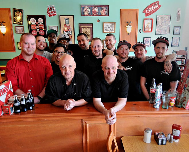Rich and Jim Bova, center, owners of Maryanne's Home Style Cooking in Middletown with their staff.