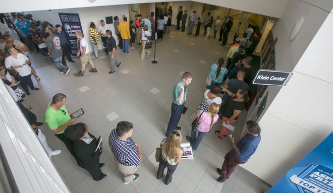 Job candidates wait to attend an informational meeting at the FedEx job fair at the College of Central Florida in Ocala in this July 6 file photo.  (Alan Youngblood/Star-Banner file photo)