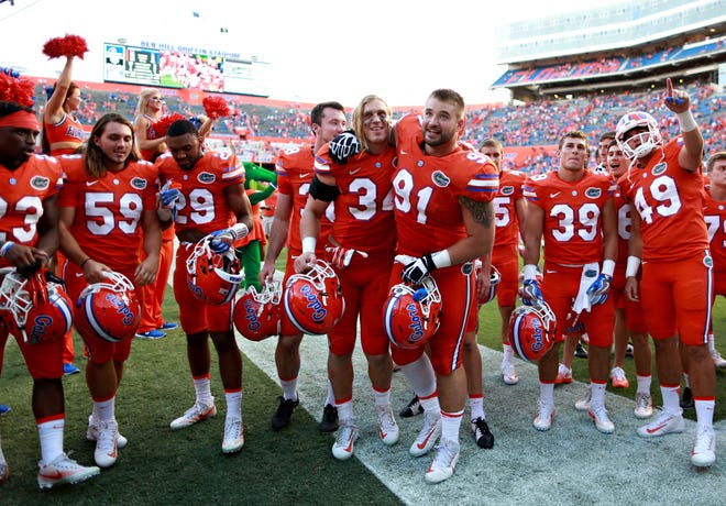 Florida players celebrate following the Gators' 45-7 win over Kentucky on Sept. 10 on Steve Spurrier Florida Field at Ben Hill Griffin Stadium in Gainesville. (Rob C. Witzel/Staff photographer)