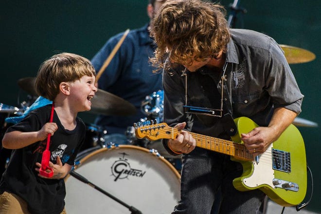 Jack Bible joined his dad, Jason Bible of the Train Wrecks, on stage at the 7th annual Statts Fest in Grayson Stadium. (Geoff L. Johnson/For the Savannah Morning News)
