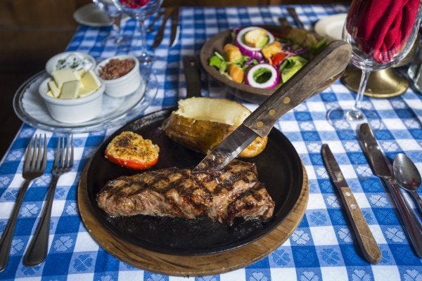 At Angus Barn in Raleigh, the New York strip is the most requested steak: 'It has got that layer of fat around it, and it gives it a great flavor.'