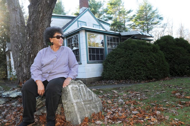 Valerie Cunningham sits on the stonewall at Rock Rest in Kittery Point, Maine, which was a popular destination for vacationing African Americans.

Photo by Deb Cram/Seacoastonline