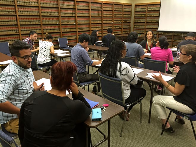A workshop conducted by Legal Aid Foundation of Los Angeles for ITT students to explain their options is held on Sept. 8, 2016. Ronald D. White/Los Angeles Times