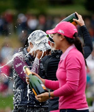 In Gee Chun of South Korea celebrates after winning the Evian Championship women's golf tournament in Evian, eastern France, Sunday, Sept. 18, 2016. (AP Photo/Laurent Cipriani)