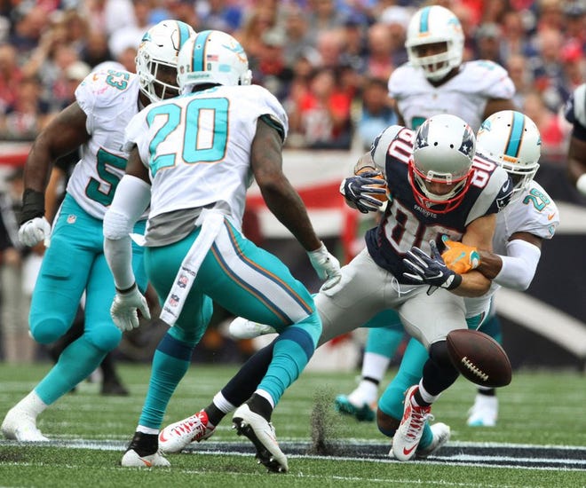 Danny Amendola loses the handles on the ball during the second quarter of Sunday's game.
