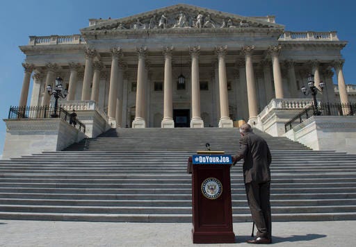 Senate Minority Leader Harry Reid of Nev., waits on the House steps of the U.S. Capitol in Washington for a rally. Driven by a desire to free up endangered lawmakers to campaign, congressional negotiators are working to quickly finalize a spending bill to prevent an election-season government shutdown and finally provide money to battle the threat of the Zika virus.