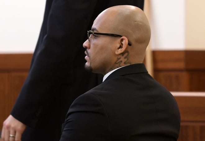 Dinkue Brown listens Monday during the first day of his murder trial in Worcester Superior Court. T&G Staff/Christine Peterson