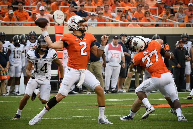 Oklahoma State Cowboys quarterback Mason Rudolph (2) looks to pass against the Pittsburgh Panthers during the second half at Boone Pickens Stadium in Stillwater, Okla., on Saturday, Sept. 17, 2016. Rob Ferguson-USA TODAY Sports