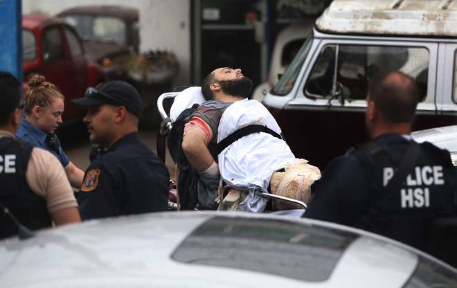 Ahmad Khan Rahami is taken into custody after a shootout with police Monday in Linden, N.J. Rahami was wanted for questioning in the bombs found in Chelsea in New York and Seaside Park in New Jersey.