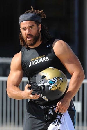Bob.Mack@jacksonville.com - 5/26/16 - Jared Odrick pumps himself up at he joked with the photographers waiting for the OTA to start. The Jacksonville Jaguars held one of the offseason OTA's (Organized Team Activities) on The Florida Blue Health and Wellness Practice Fields in Jacksonville, FL. (The Florida Times-Union, Bob Mack)