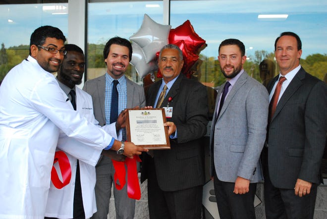 From left: Dr. Mohammad Ali, Primary Care; Dr. Pete Obeng, Occupational Medicine; Tyler Day of State Representative Jack Raderís Office; Lamont Louis, Vice President, Physician Network; Taylor Munoz of State Senator Mario Scavelloís Office; Jeff Snyder, President and CEO.(Photo provided)
