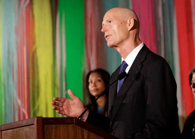 Florida Gov. Rick Scott speaks during a news conference on Monday at Wynwood Walls in the Wynwood neighborhood of Miami.