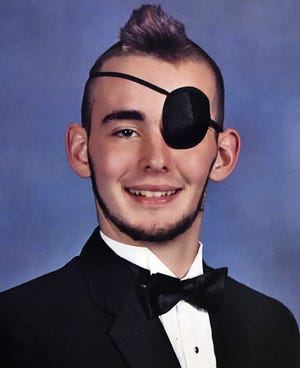 Jamie Myers cut his hair into a mohawk after he started losing it during chemotherapy. For his 2015 Pine View portrait, he sported the mohawk and an eye patch. He was diagnosed with brain cancer during his junior year in high school and died Aug. 24. COURTESY / LEONARD'S PHOTOGRAPHY