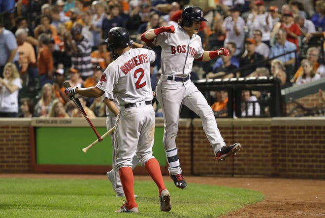 Boston's Andrew Benintendi, right, celebrates his three-run home run with teammate Xander Bogaerts during the Red Sox' 5-1 win over the Orioles on Wednesday. THE ASSOCIATED PRESS
