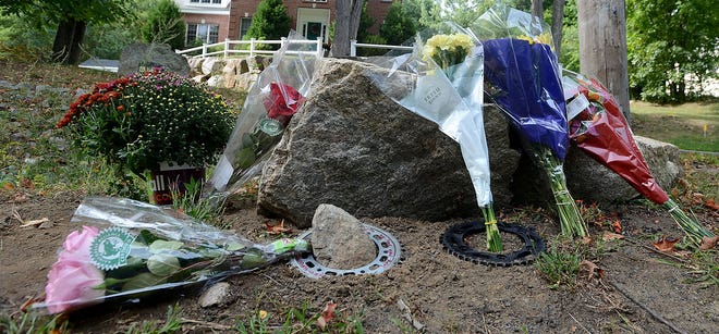 A small roadside memorial at 121 Cedar St. in Ashland Wednesday for a 27-year-old Framingham man who died in a motorcycle crash Saturday night. (Daily News and Wicked Local Staff Photo/Ken McGagh)