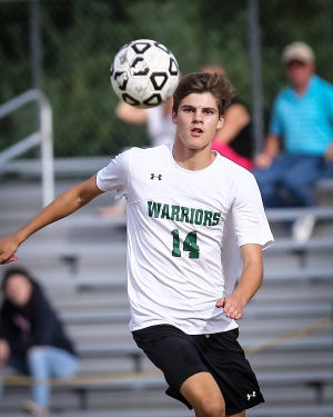 Nipmuc's Jonas Walter chases down the ball during the boys soccer game against Hopedale at Nipmuc Regional High School in Upton on Wednesday. Daily News and Wicked Local Photo/Dan Holmes