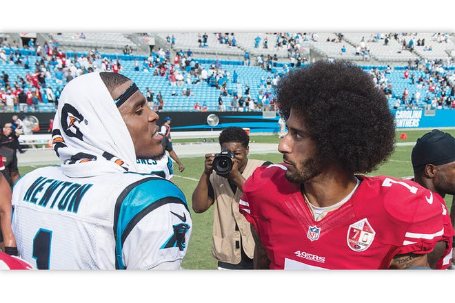 Carolina Panthers quarterback Cam Newton and San Francisco 49ers quarterback Colin Kaepernick eye each other up in the now-often-memed photo taken by The Courier-Tribune stringer PJ Ward-Brown.