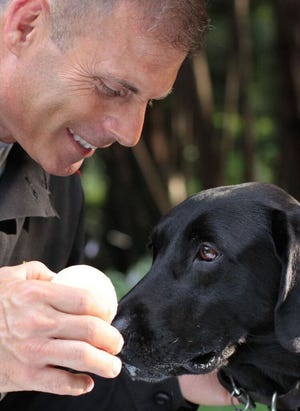 Matthew Zarella and Buster in a scene from "Searchdog."