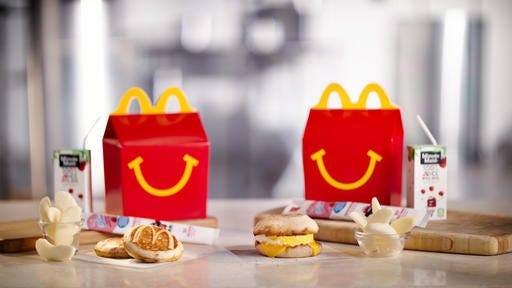 This photo provided by McDonald's shows a breakfast Happy Meal. McDonald's is considering another addition to its all-day breakfast menu: Happy Meals. The fast-food chain says it will begin testing breakfast Happy Meals in Tulsa, Oklahoma on Sept. 26. The Happy Meals come with either two McGriddles cakes or an egg and cheese McMuffin.(McDonalds via AP)