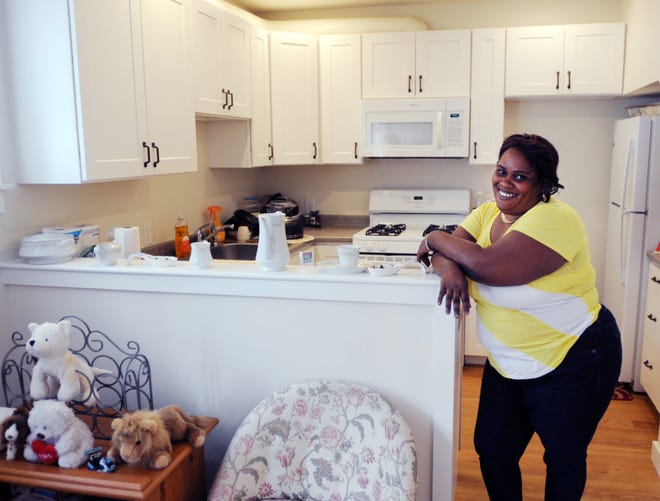Anekie Campbell shows off her two-bedroom home at Stable Path, a new affordable rental complex in Provincetown. She previously lived in one room in Eastham. Steve Haines/Cape Cod Times