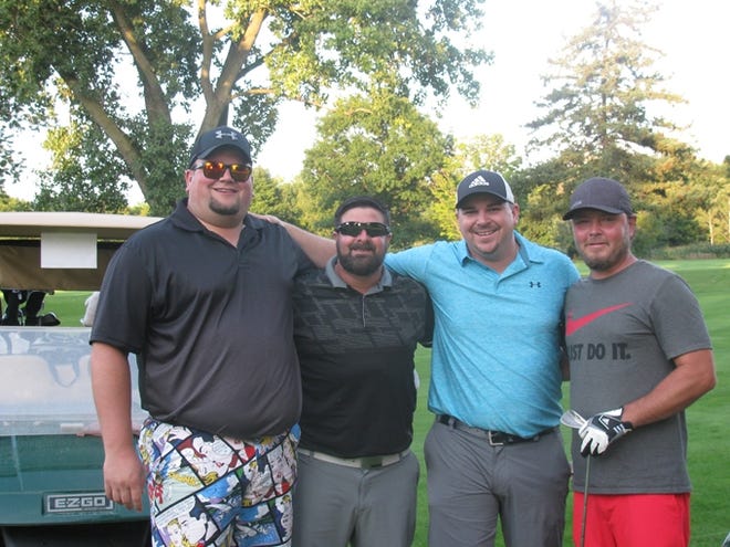 The winners of the evening golf, Mike Rogers, Adam Cappella, Mike Kasperski, and Billy Kinsey, enjoy the course. Courtesy Photo