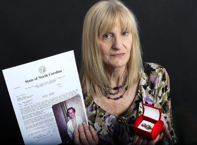 Donna Amagliano holds a letter from the N.C. Parole Board along with two rings that belonged to her aunt Muriel Lee Guin. Her aunt was murdered in 1993 by Tony Hartsell who is currently serving a life sentence but has a parole hearing on Oct. 11. JOHN CLARK/THE GAZETTE