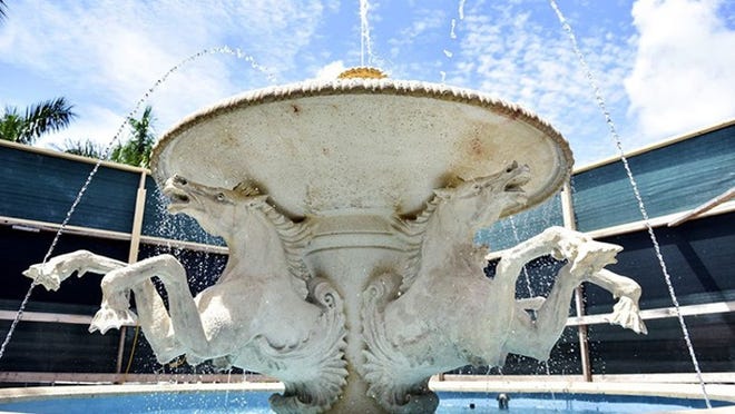 Water flows in the nearly restored Memorial Fountain Friday.