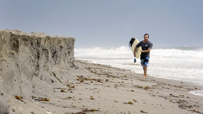 Mike Butalo, Lantana, spent Sunday morning surfing at Midtown Beach. “These are the first good waves we’ve had since May” said Butalo who prefers Midtown because the break is closer to shore.