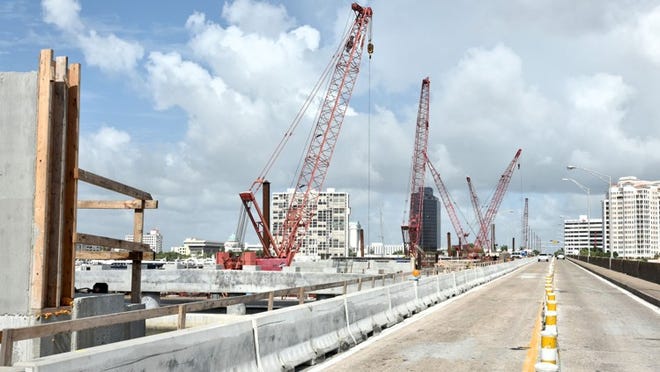 Workers building building the new Flagler Memorial Bridge began securing the construction site Friday ahead of Tropical Storm Erika. Daily News File Photo