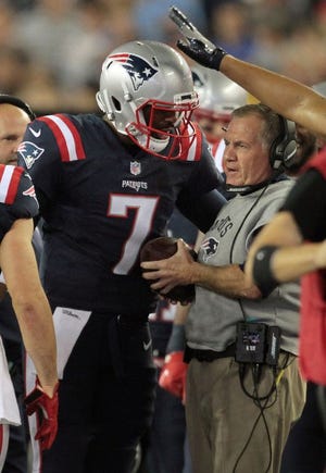 After scoring his first NFL touchdown, Jacoby Brissett hands the ball to Bill Belichick.