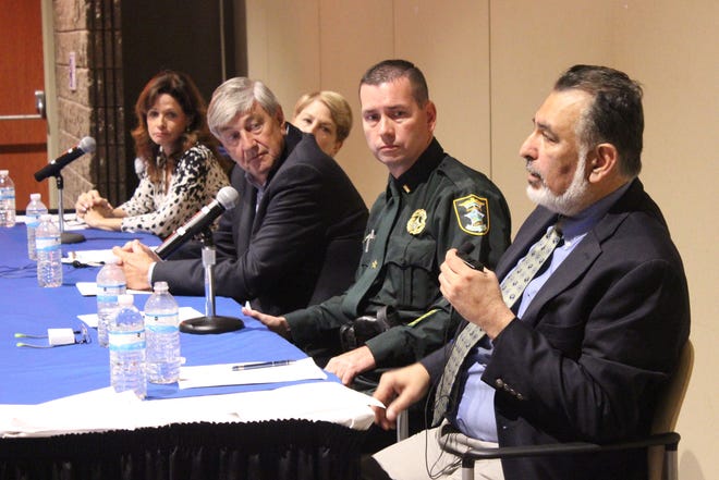 Panelists at a community conversation about mental health, from left : Suzan Brodsky, NAMI peer-to-peer mentor; Linda Stone, CEO of Community Health Centers of Sarasota County; Parlane Reid, Sarasota psychiatrist; Lt. Charles Kenniff of the Sarasota County Sheriff's Office, and Rajiv Tandon, psychiatrist and president of NAMI Florida. PHOTO BY DOUG JOHNSON