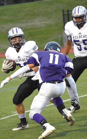 Three Rivers’ Tyson New looks to avoid a tackle from an Otsego defender Friday night.