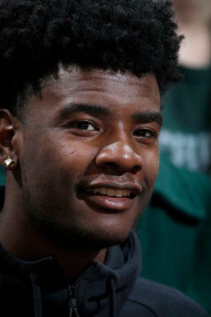 Basketball recruit Josh Jackson watches an NCAA college basketball game between Michigan State and Ohio State, Saturday, March 5, 2016, in East Lansing, Mich. Michigan State won 91-76. (AP Photo/Al Goldis)