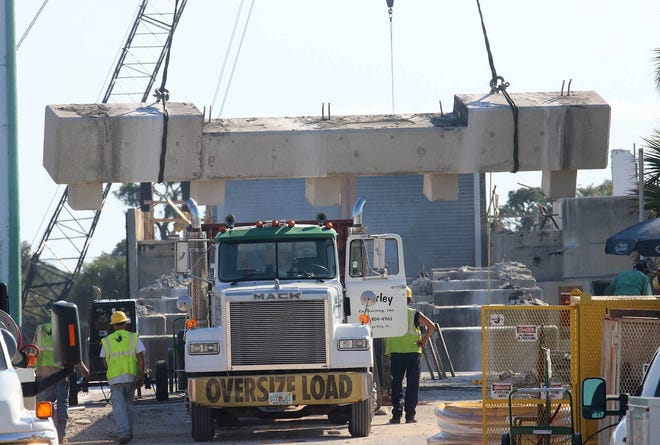 Construction crews were hard at work earlier this month on tearing down the old Orange Avenue drawbridge to make way for the Veterans Memorial Bridge. Volusia County is accepting donations to fund a veterans park as part of the bridge project. News-Journal/JIM TILLER