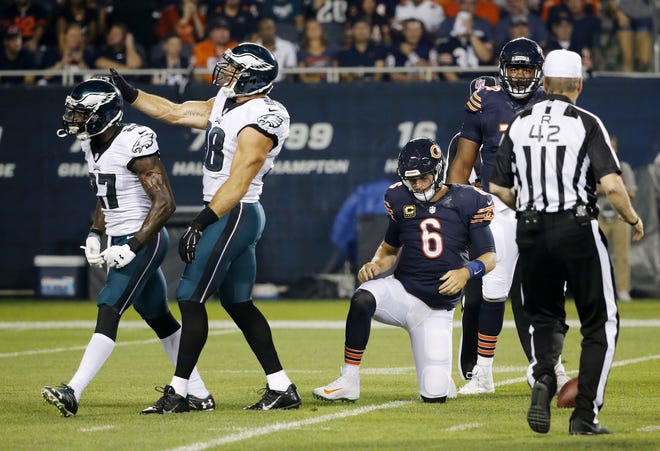 Philadelphia Eagles strong safety Malcolm Jenkins, left, celebrates with inside linebacker Jordan Hicks (58) as Chicago Bears quarterback Jay Cutler (6) gets up after a quarterback sack during the first half last Monday's game in Chicago. (AP Photo/Charles Rex Arbogast)