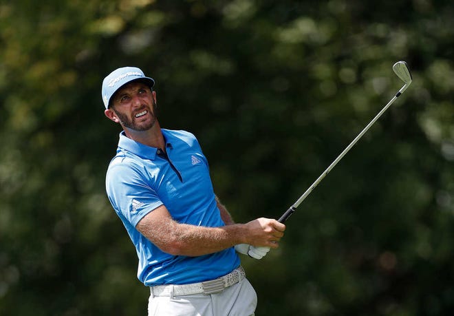 Dustin Johnson watches his tee shot on the second hole during the second round of play at the Tour Championship golf tournament at East Lake Golf Club Friday, Sept. 23, 2016, in Atlanta. (AP Photo/John Bazemore)