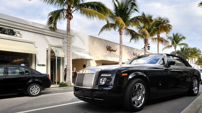 A Rolls Royce Phantom Drophead Coupe drives down Worth Avenue. Jeffrey Langlois/Daily News
