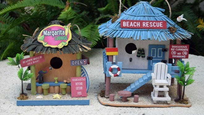 Handcrafted birdhouses ($32-$38), designed to look like a beach bar and lifeguard tower, are available at Sherry Frankel’s Melangerie. Photo by Kelly Blatt