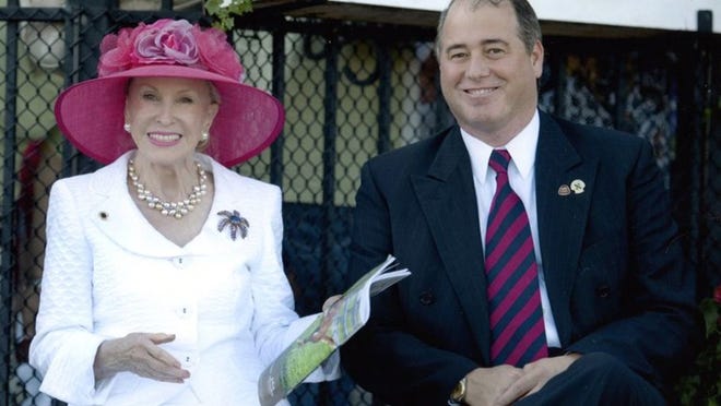 Marylou Whitney and her husband John Henrickson, in the winner’s circle at Saratoga, appropriately. Marylou’s hat is by Christine Moore, New York. Suit is by Escada.