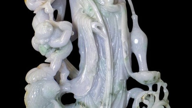 A jadeite figure of Guanyin, a Buddhist goddess of mercy, is part of de Porro’s personal collection that will be auctioned Sunday. Opening bid is $2,500.