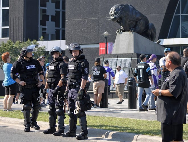 Extra security was posted on Sunday outside the stadium in Charlotte, North Carolina, hosting the Minnesota Vikings and the Carolina Panthers in response to protests over the shooting death of a black man by a police officer on Sept. 20.