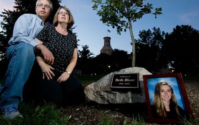 Terry and Lisa Blunt reflect next to a memorial for their 22-year-old daughter, Beth, who lost her battle with heroin addiction. Rockford Register Star / MAX GERSH