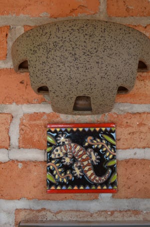 A porch light and Southwestern painted tile on the front porch of the Sanctuary Cove guest cottage in Marana, Ariz.



Mark Mittelstadt via AP