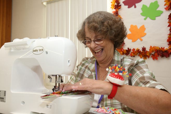 Charlotte Williams uses her sewing machine (named Rachel) to sew part of a quilt during a meeting of the Anthony Quilt 'N Go Club at the Anthony First Baptist Church in Anthony, Fla. on Thursday, Sept. 22, 2106. The club, which has 20 members and meets every week, is getting ready for their quilting show that will be held on Oct. 7-8 from 10 a.m. to 4 p.m. at the McIntosh Civic Center. (Star-Banner Photo/Bruce Ackerman) 2016.