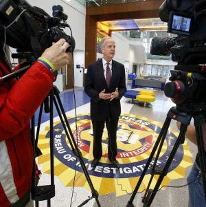 U.S. Sen. Jerry Moran talks to reporters March 18 before touring the Kansas Bureau of Investigation's new Forensic Science Center on the campus of Washburn University.
