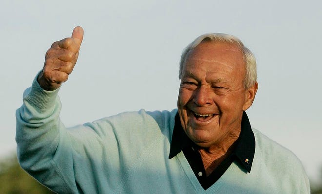 Former Masters champion Arnold Palmer acknowledges the crowd after hitting the ceremonial first tee shot prior to the first round of the 2007 Masters golf tournament at the Augusta National Golf Club in Augusta, Ga. Palmer died Sunday, Sept. 25, 2016, in Pittsburgh. He was 87.