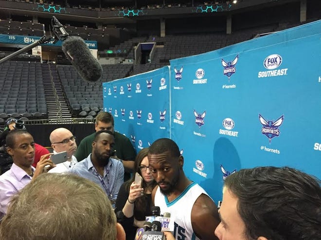 Charlotte Hornets guard Kemba Walker answers questions during Monday's "Media Day" at Time Warner Cable Arena. (Photo by Richard Walker/The Gazette)
